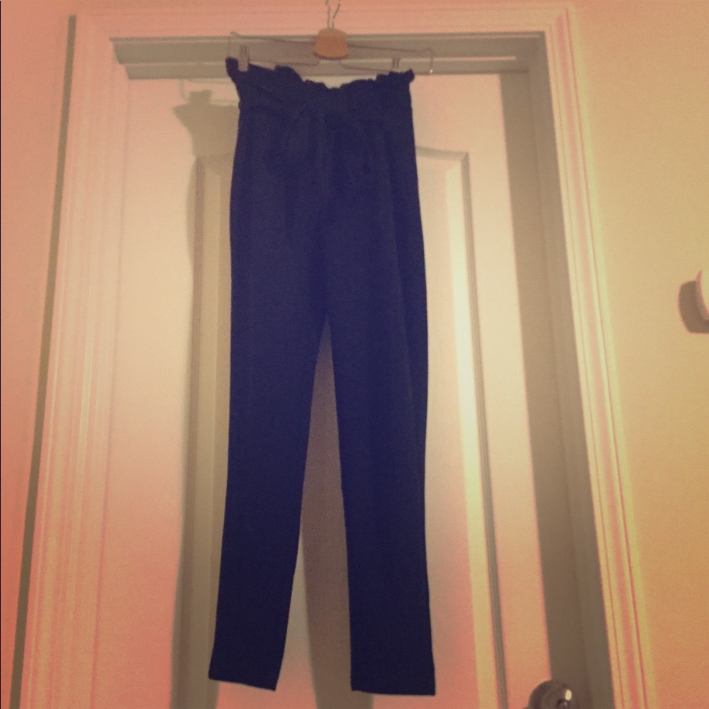 Paper bag waisted pants w/ ribbon belt. Like new.